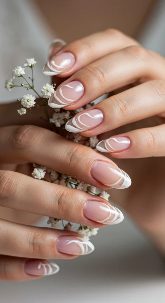 Elegant White Swirls on Almond Nails